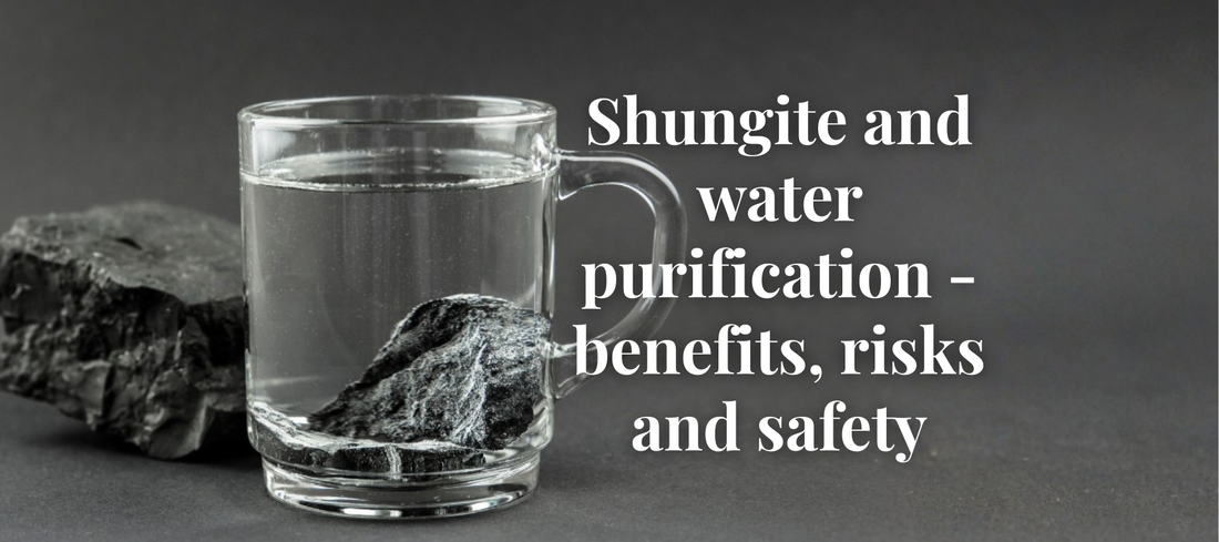Glass jug of water with Elite Shungite stones